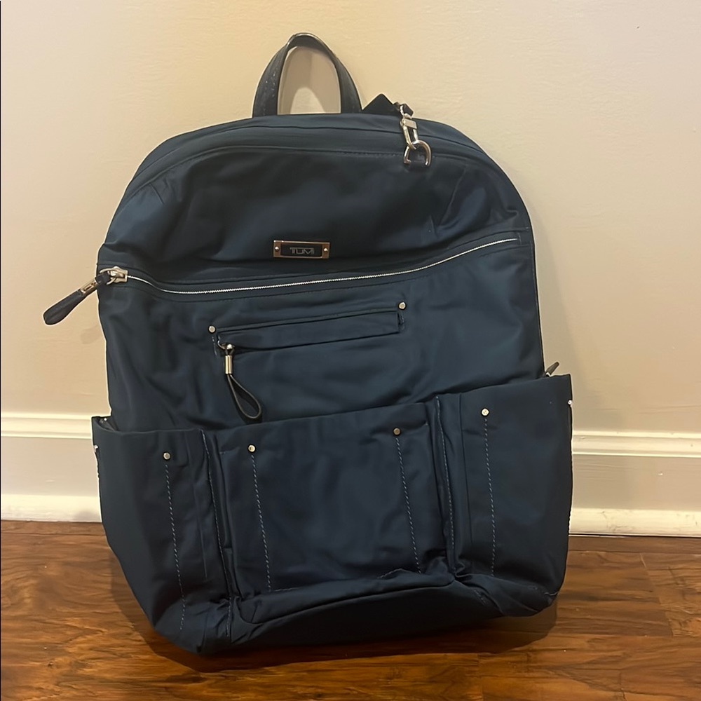 Tumi Blue Backpack with Adjustable Straps and multiple pockets
